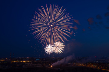 several outbreaks of fireworks on background of night sky