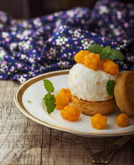 Homemade ice cream with berries cloudberries.