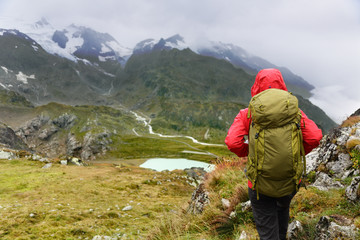 Fototapeta na wymiar Hiking hiker on trek in mountains with backpack