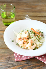 Risotto with shrimp and dill on a plate