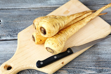 Raw Parsnip on a cutting board