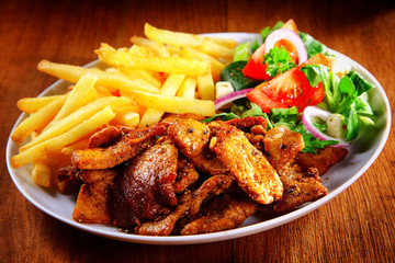 Tasty Meal Combination of Meat, Fries and Veggies