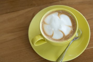 Hot coffee in the yellow Cup