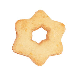 Light Christmas gingerbread in the form of the star on the white