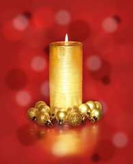 Golden Christmas Candles and spheres on the red