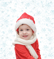 the three-year-old  child in Santa Claus and snowflakes