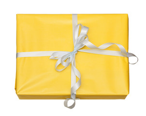 gift in yellow packing with a white bow