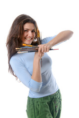 Artist is holding her brushes with both hands