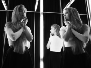 sexy girl and her reflection in mirror table