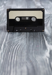 Music concept. Black audio cassette