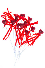 Red valentine heart shaped decorations with ribbon and bows 