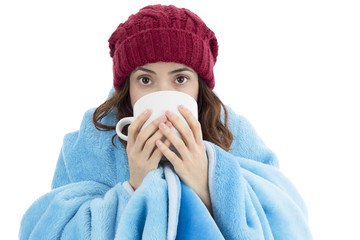 Woman feeling cold and drinking warm tea
