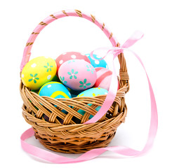 Colorful handmade easter eggs in the basket isolated