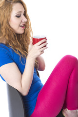 Model Released. Attractive Young Woman Drinking Tea