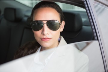 Woman wearing sunglasses looking at camera