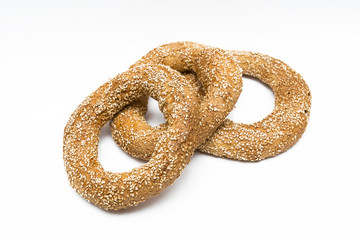 Thre sesamy breads on a white background
