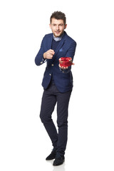 Businessman with a heart-shaped gift isolated on white backgroun