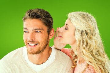 Attractive blonde whispering secret to boyfriend