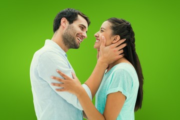 Composite image of attractive young couple about to kiss