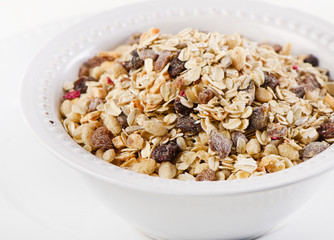 Muesli for breakfast in a white bowl