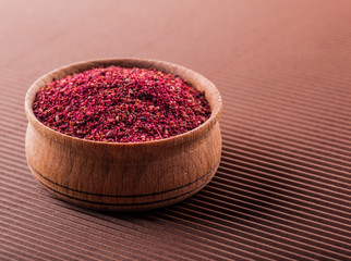 sumac in a wooden bowl
