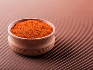 paprika in a wooden bowl