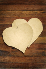 old paper with wooden heart sign