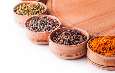 saffron,cloves,paprika in a wooden bowl