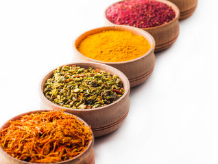 spice saffron,paprika, pepper in a wooden bowl