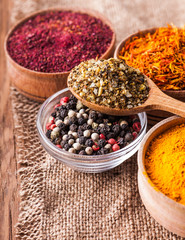 spices in a wooden and glass bowls close-up