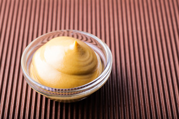 mustard in a glass bowl close-up