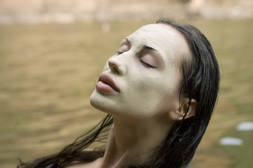 Woman with blue clay facial mask in beauty spa (Outdoor)