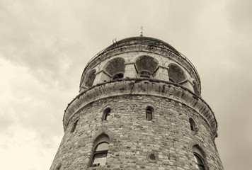Fototapeta na wymiar Magnificence of Galata Tower as seen from the street - Beyoglu,