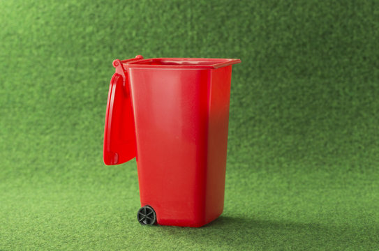red open garbage bin container
