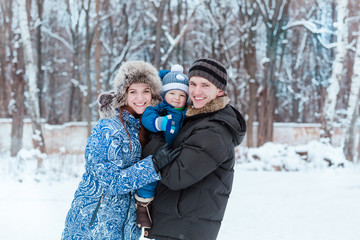 Fototapeta premium Happy family playing on snow