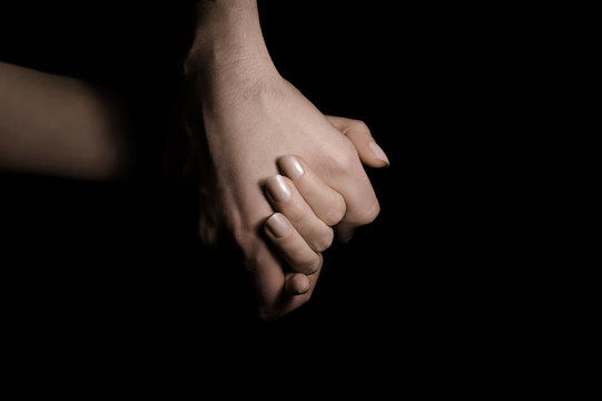 holding hands in the dark