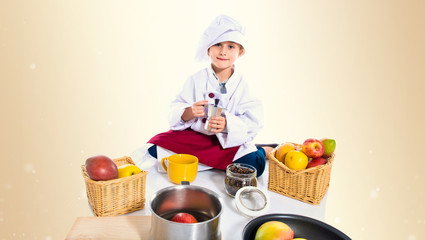 Blonde little girl dressed like chef