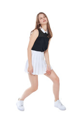 Young fashion girl in white skirt posing isolated