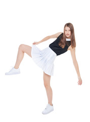 Fototapeta na wymiar Young fashion girl in white skirt posing isolated