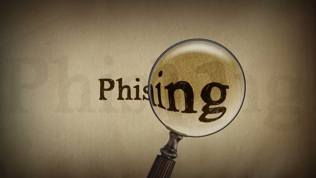 Schriftzug Phishing mit Lupe