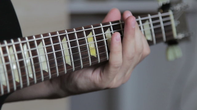 Guitarist play on electric guitar