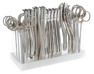 A large set of orthodontic pliers on a white background