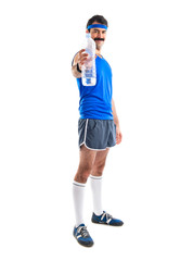 Vintage sportman holding a bottle of water