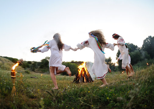 Girls In Ukrainian National Shirts Dancing Around A Campfire