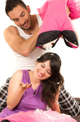 Obraz premium cute attractive couple having a pillow fight