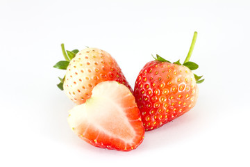Strawberries Berries with a half section on white