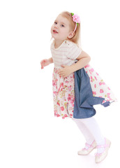 Adorable little girl jumping.