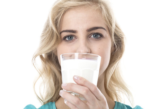 Attractive Young Woman Drinking a Glass of Milk