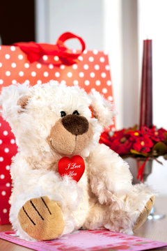 Teddy bear toy and gift box. Valentine's day surprise.