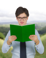 man holding green book